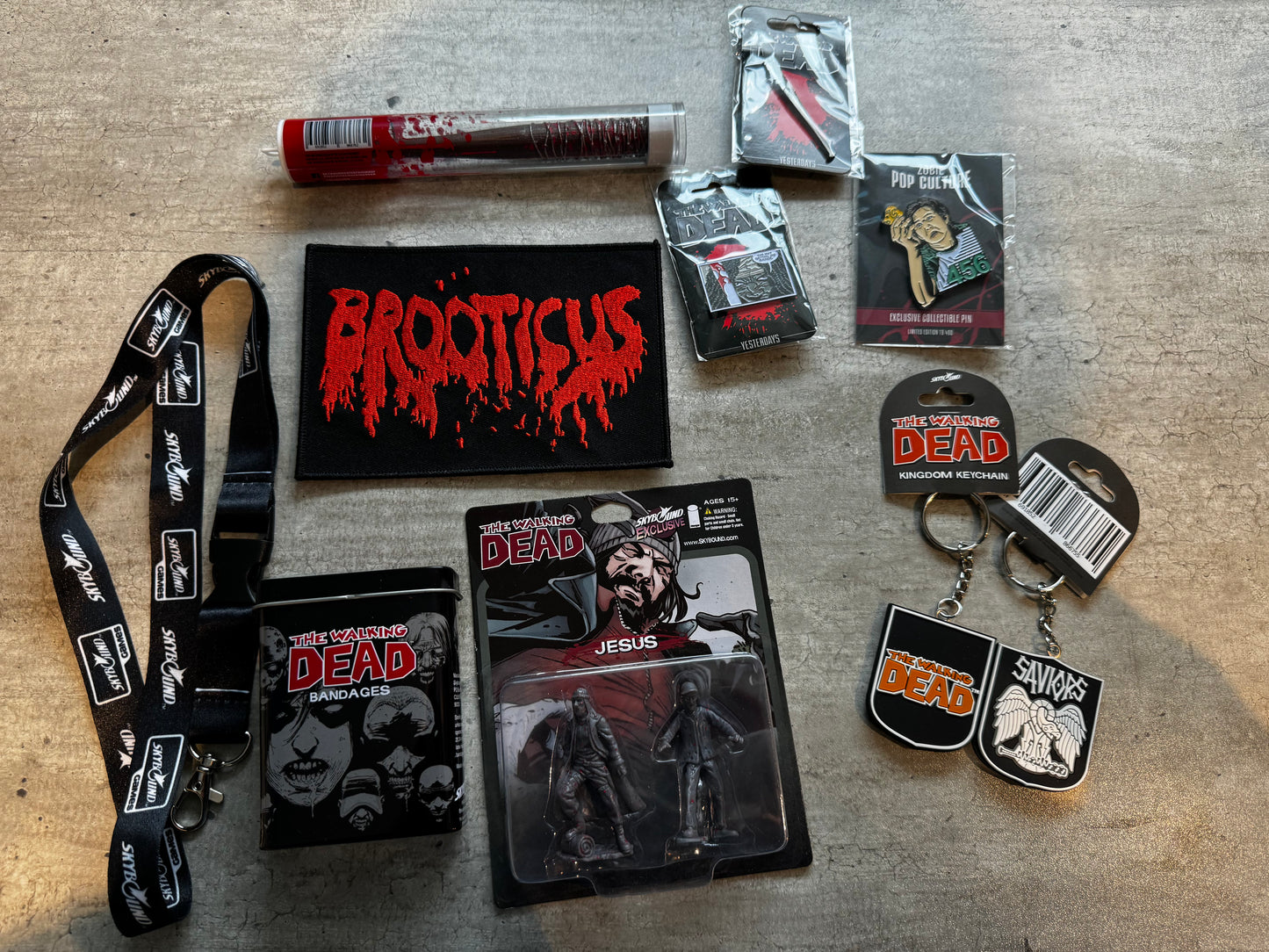 The Walking Dead Miniature Figurine Jesus Comic Book version Skybound exclusive; Lucille The Walking Dead Comic Bat Ballpoint Pen Black & White Blood Negan 2016; lanyard; The Walking Dead bandages; Brooticus patch; pins-3; keycahins-2; - MINT